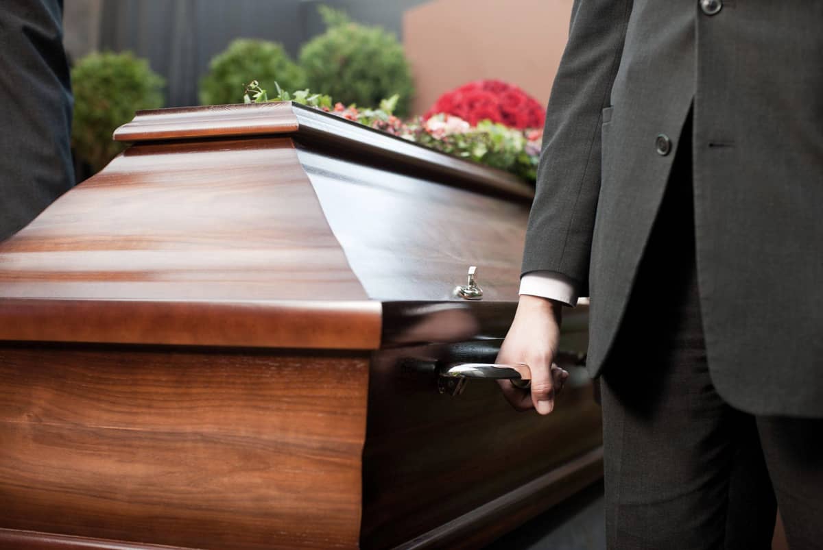 A casket being carried