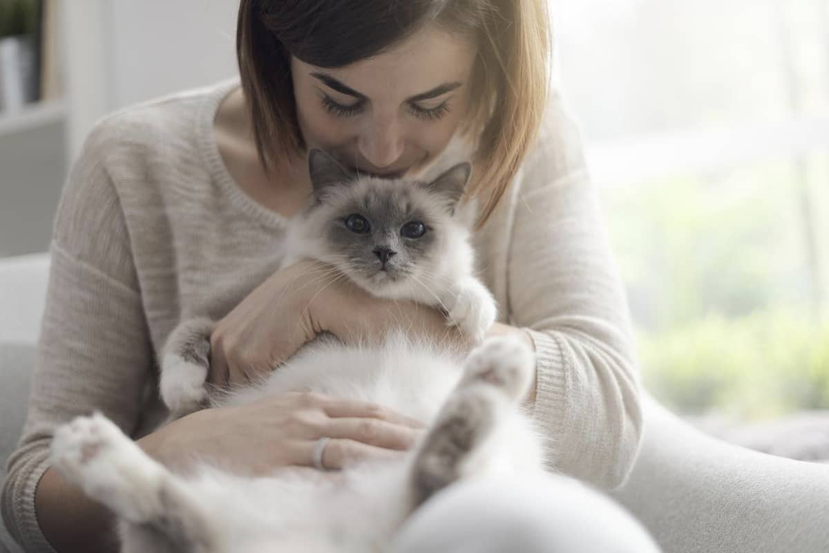 A woman holding her cat