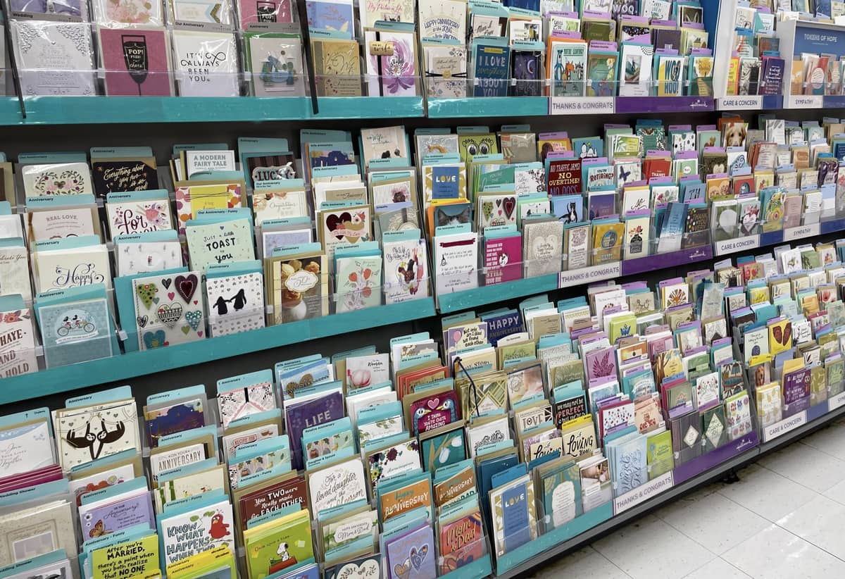 A wall of cards at a store