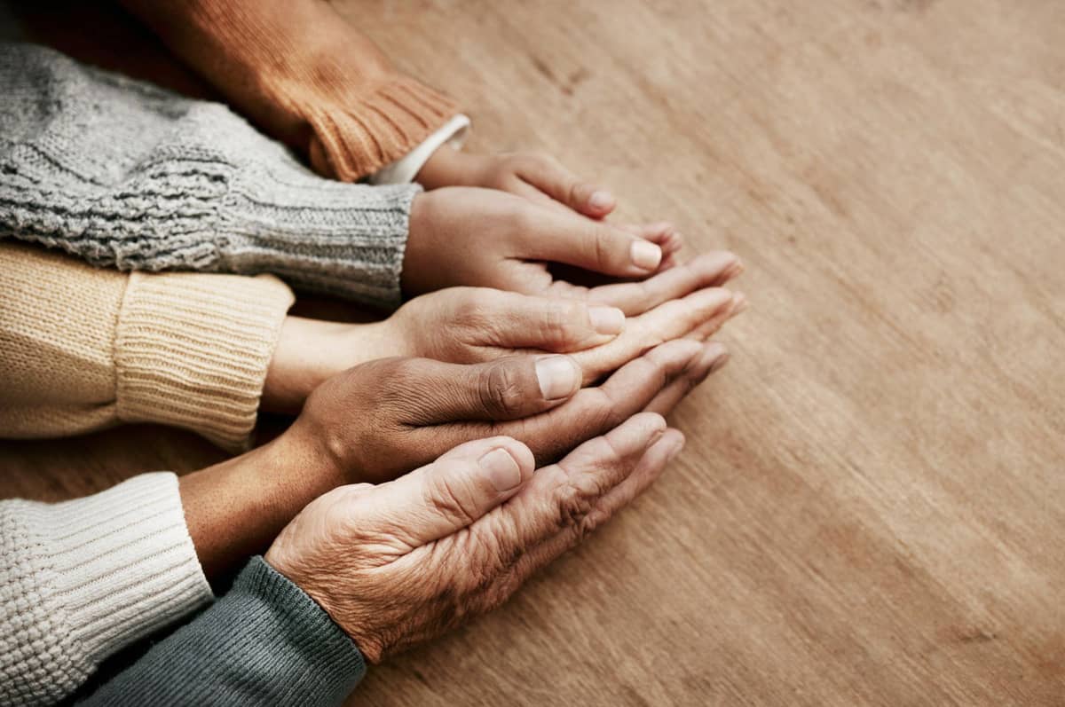 Multiple people's hands touching